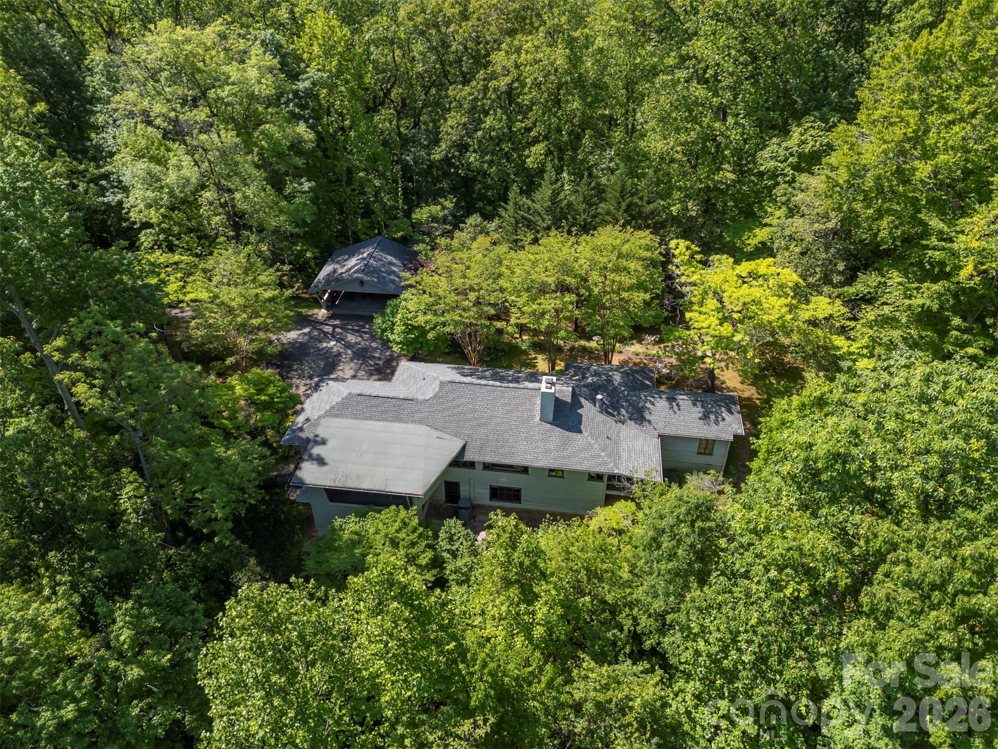 484 Sourwood Ridge Road Tryon, NC 28782 - Photo 33 of 34 an aerial view of a house with a yard