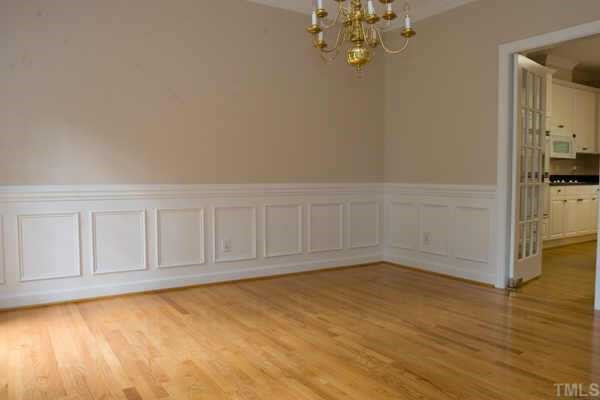 2513 Pleasant Union Church Road Raleigh, NC 27614 - Photo 3 of 10 This elegant dining room is resplendent with a hardwood floor, designer neutral wall paint, painted chairrail, crown and wainscot molding, chandelier, 2 single windows with pleated shades and a 15-light swinging door to kitchen Other