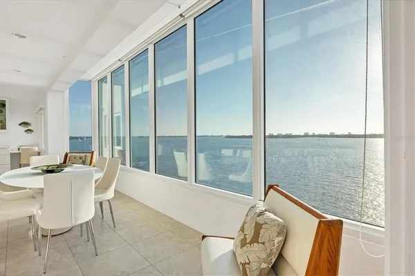 a dining room with furniture and window