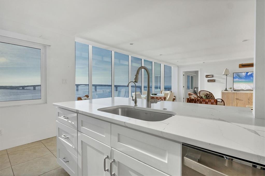 350 Golden Gate Point, Unit 62 Sarasota, FL 34236 - Photo 20 of 40 a kitchen with sink and natural light