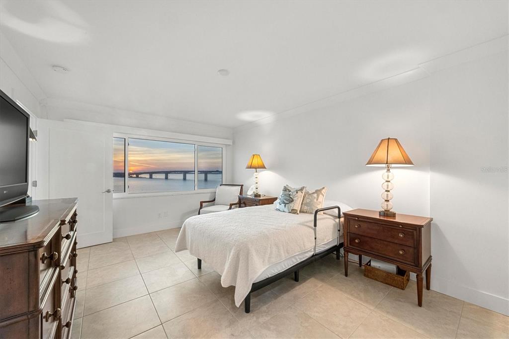 350 Golden Gate Point, Unit 62 Sarasota, FL 34236 - Photo 21 of 40 a bedroom with a bed and a window