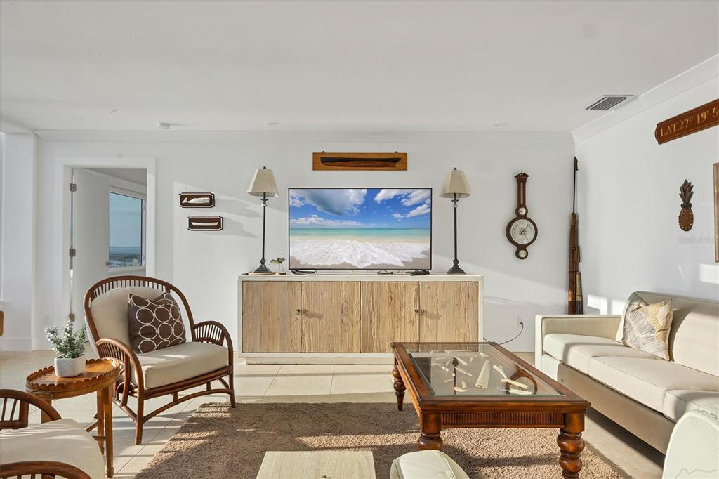 350 Golden Gate Point, Unit 62 Sarasota, FL 34236 - Photo 7 of 40 a living room with furniture and a window