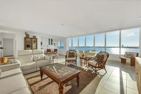 a living room with furniture and a table
