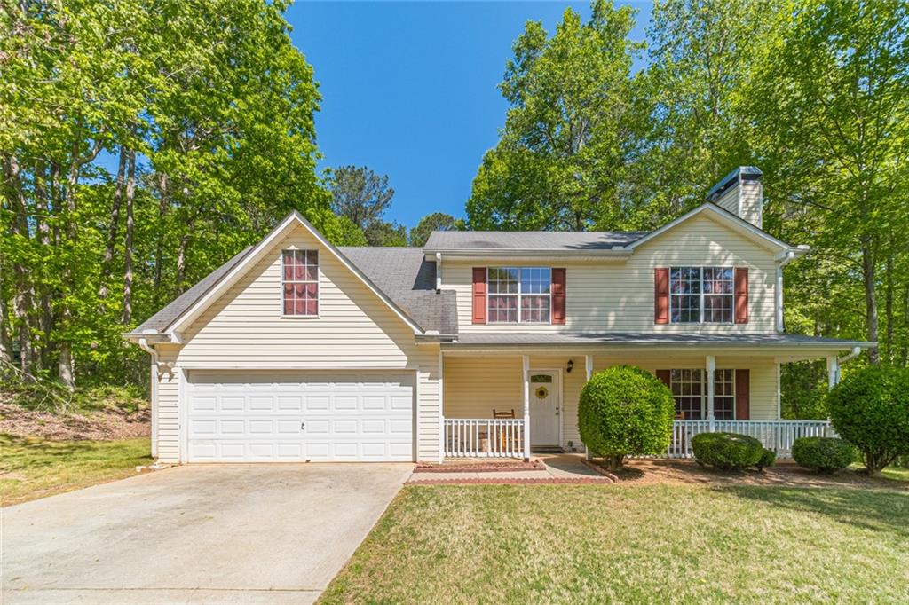 1853 River Bluff Road Monroe, GA 30656 - Photo 1 of 1 a front view of a house with a yard and potted plants