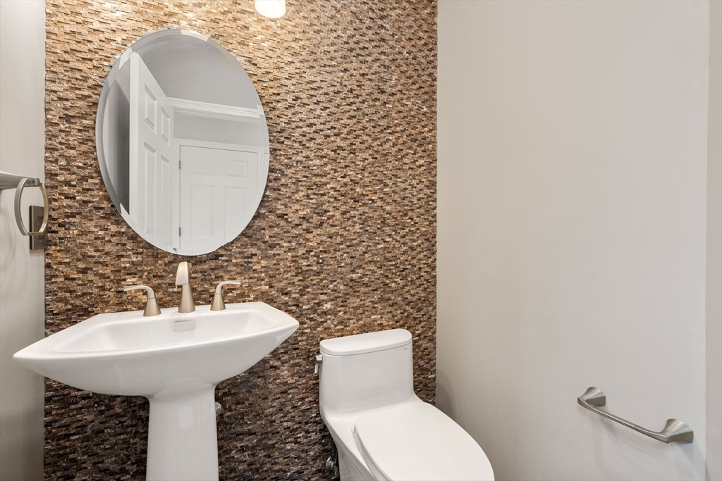 11 Black Elk Road Sharon, MA 02067 - Photo 15 of 28 a bathroom with a sink toilet and mirror
