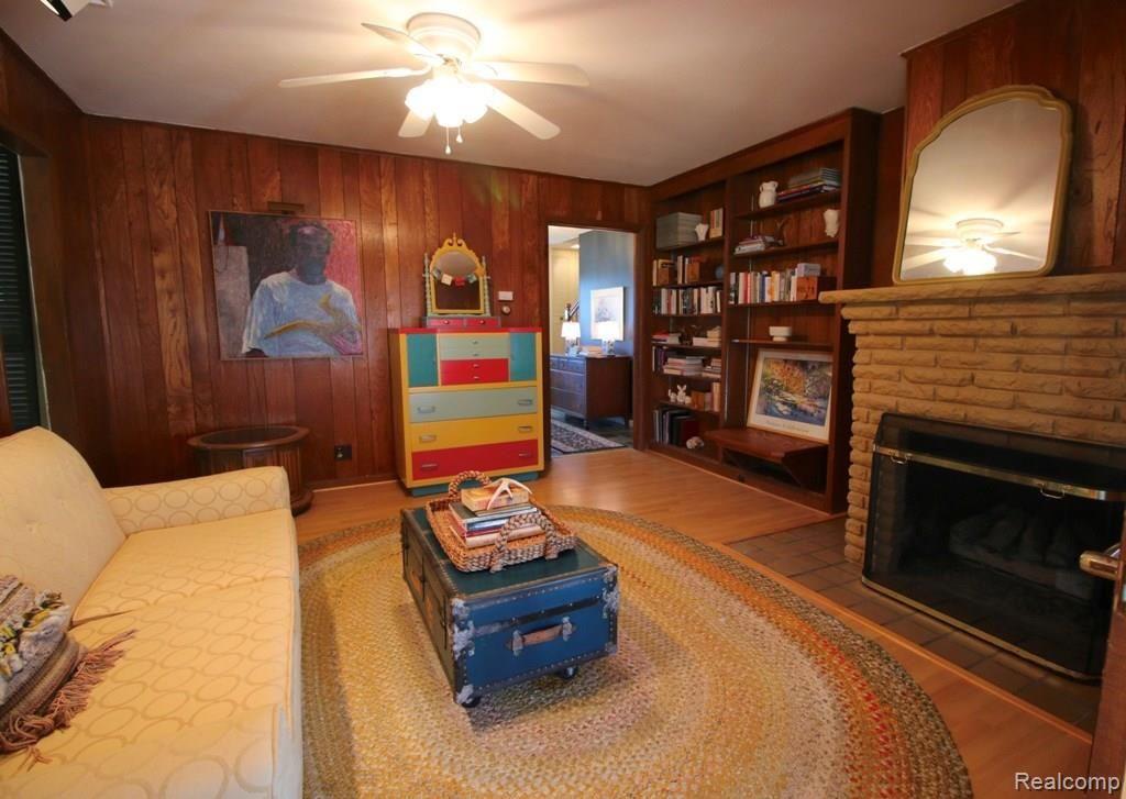 1080 West Highland Road Howell, MI 48843 - Photo 14 of 37 DEN/FAMILY ROOM WITH LAMINATE WOOD FLOOR