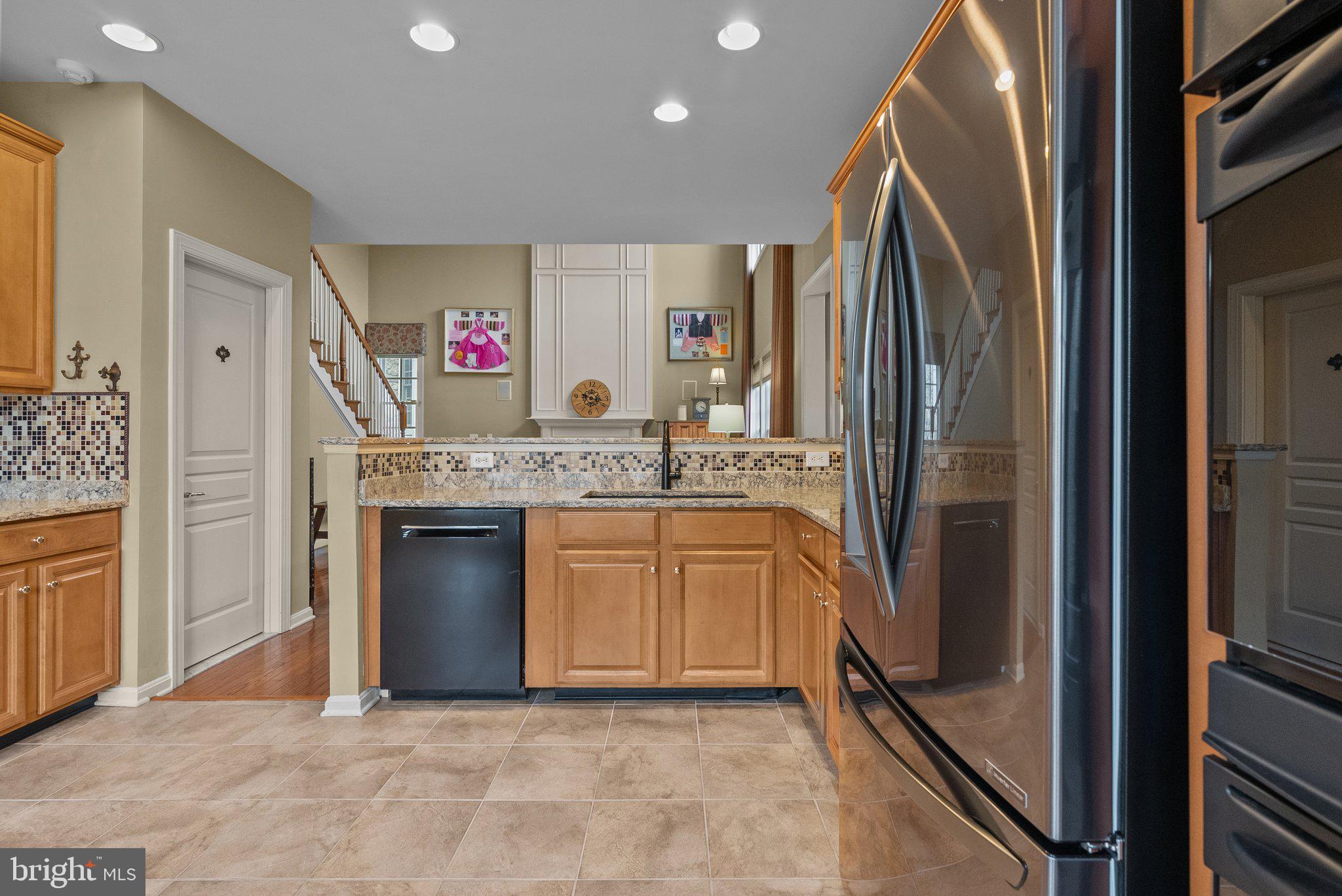 1606 Reading Circle Huntingdon Valley, PA 19006 - Photo 13 of 41 a kitchen with stainless steel appliances granite countertop a refrigerator and a sink