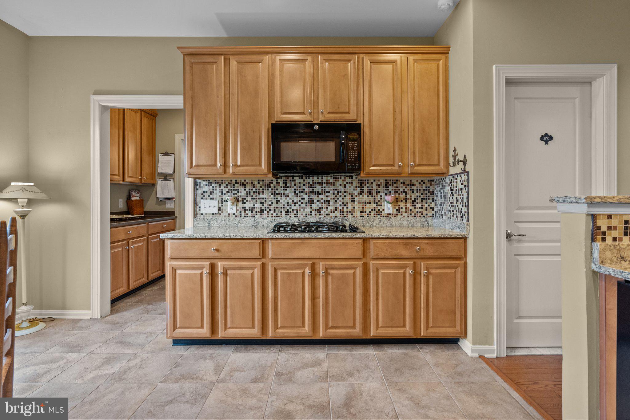 1606 Reading Circle Huntingdon Valley, PA 19006 - Photo 14 of 41 a kitchen with stainless steel appliances granite countertop a stove a sink and a refrigerator