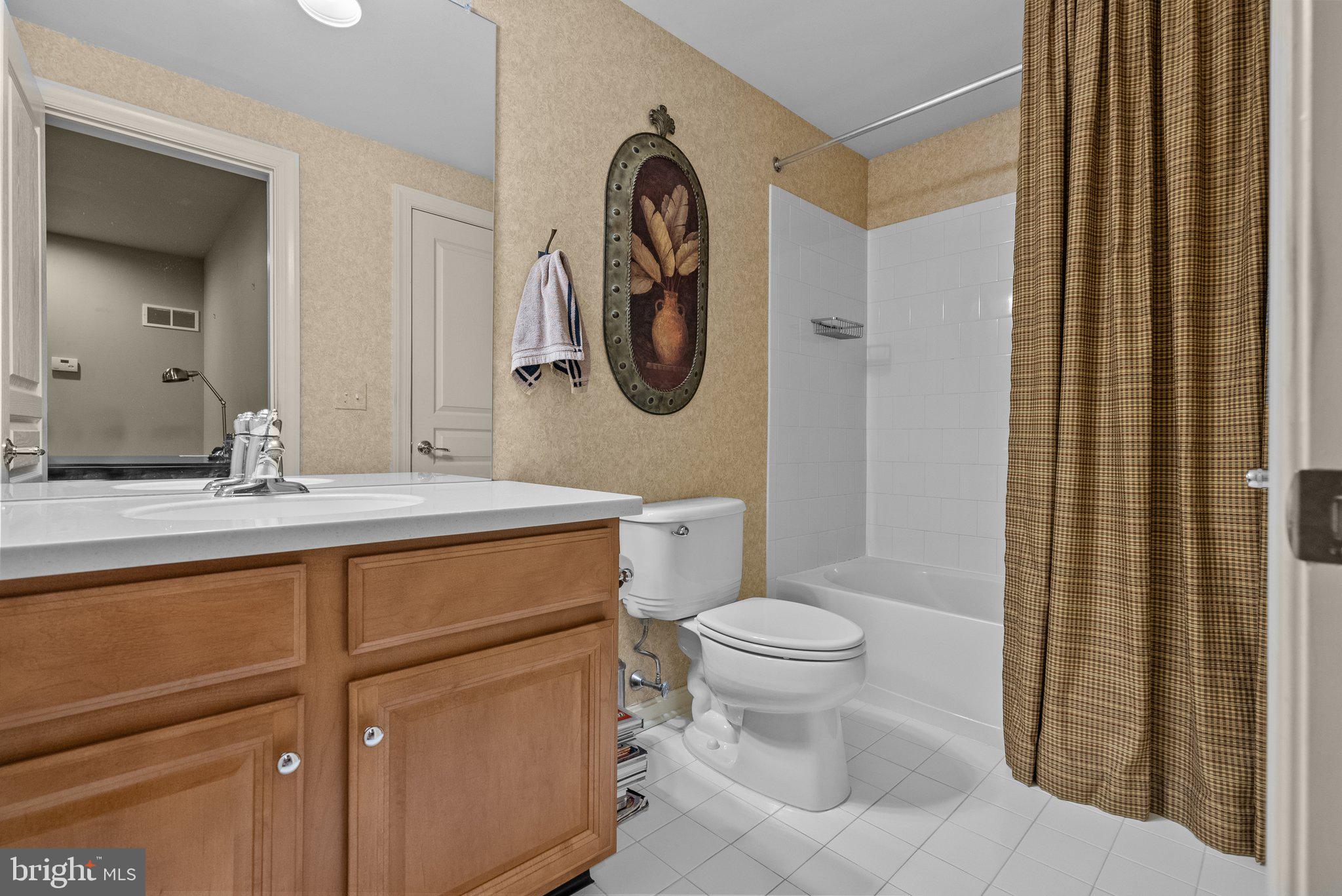 1606 Reading Circle Huntingdon Valley, PA 19006 - Photo 30 of 41 a bathroom with a toilet sink and mirror