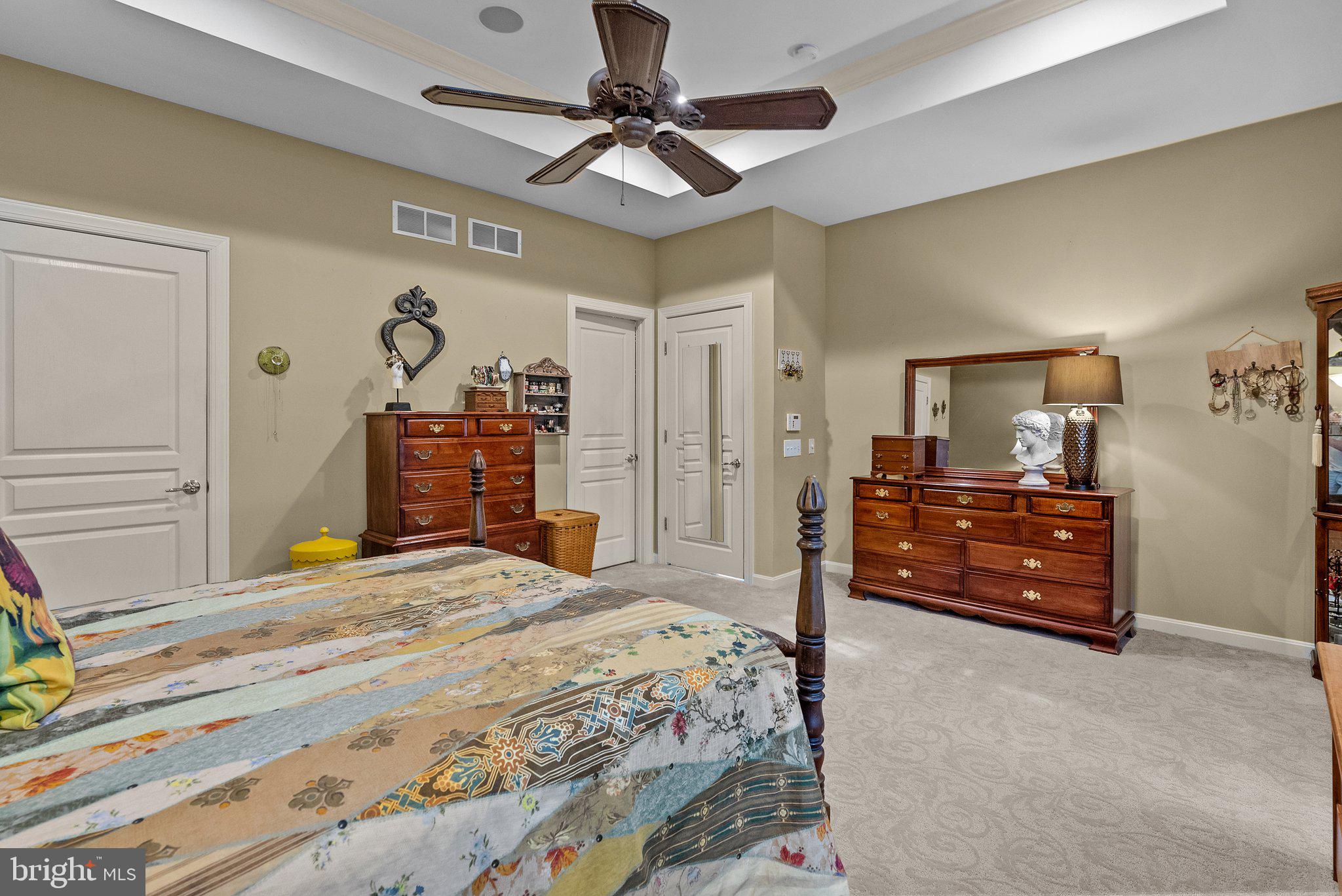 1606 Reading Circle Huntingdon Valley, PA 19006 - Photo 34 of 41 a bedroom with a bed and a chandelier