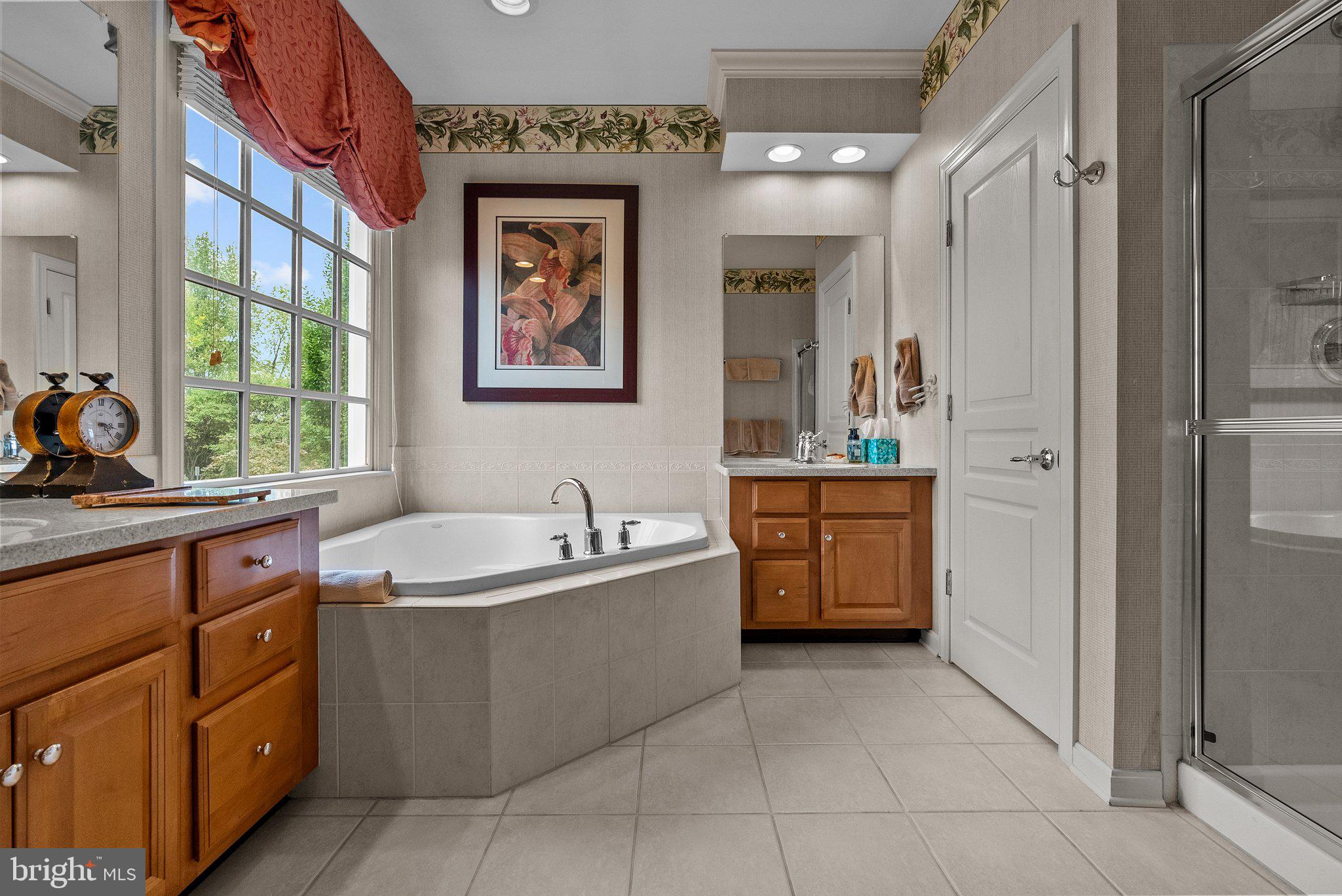 1606 Reading Circle Huntingdon Valley, PA 19006 - Photo 35 of 41 a bathroom with a bathtub sink and mirror