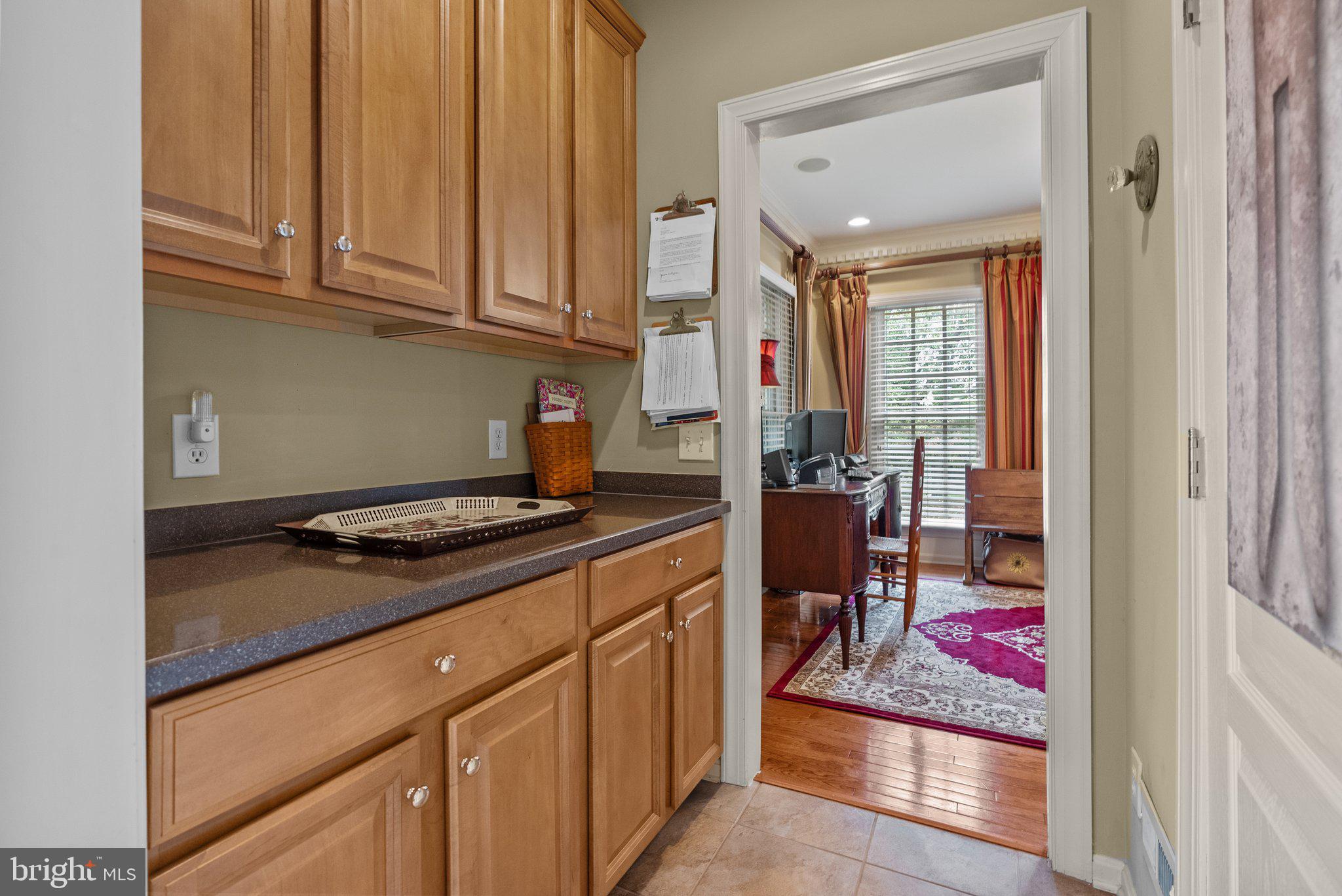 1606 Reading Circle Huntingdon Valley, PA 19006 - Photo 10 of 41 a kitchen with stainless steel appliances granite countertop a stove and a wooden cabinets