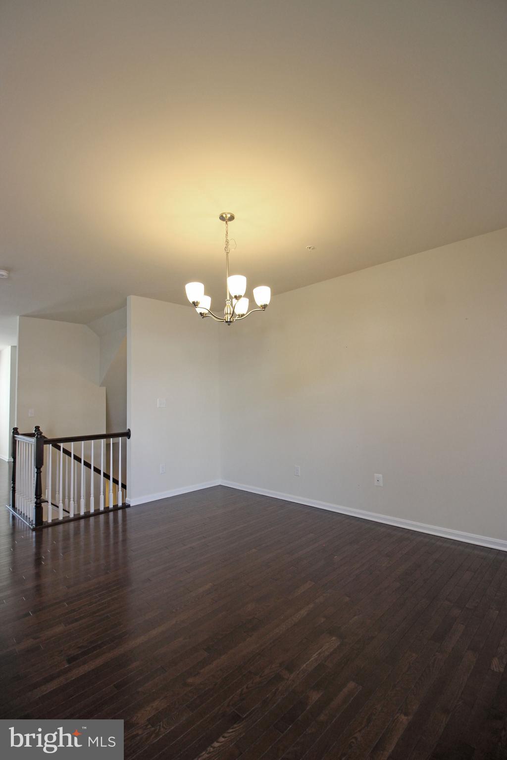 4720 Cambria Road Frederick, MD 21703 - Photo 11 of 41 an empty room with wooden floor