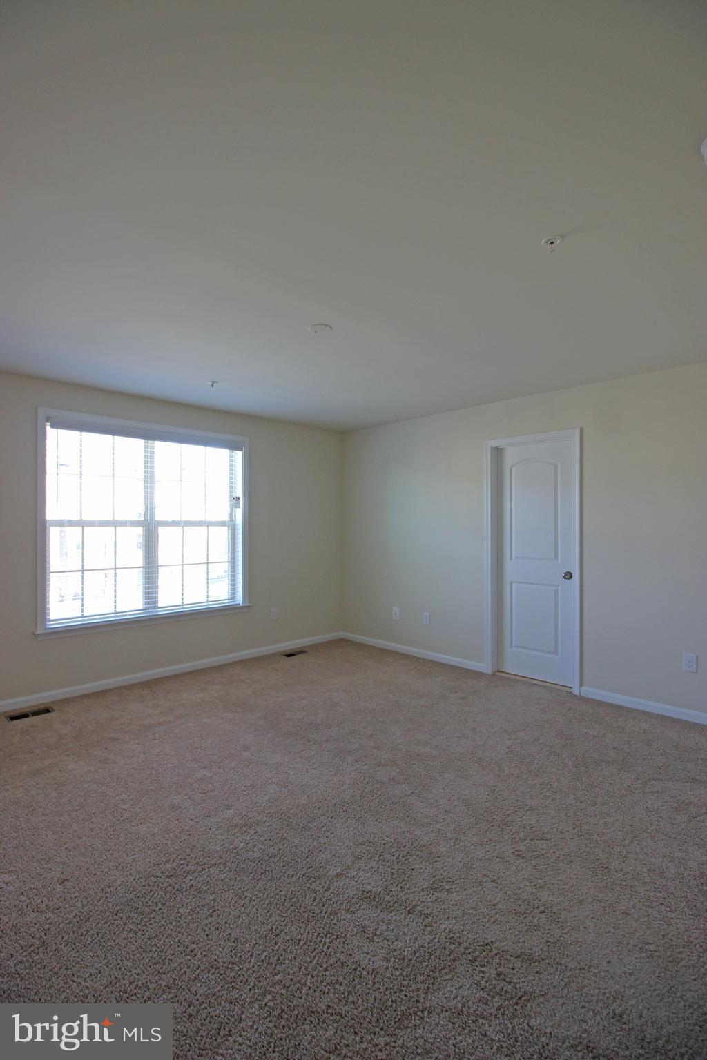 4720 Cambria Road Frederick, MD 21703 - Photo 13 of 41 an empty room with windows