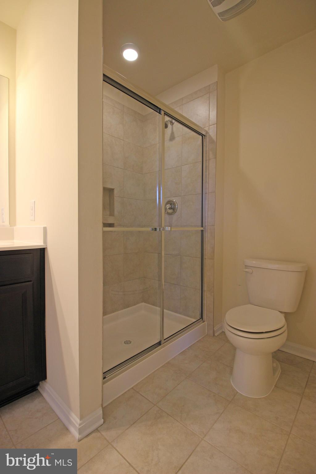 4720 Cambria Road Frederick, MD 21703 - Photo 20 of 41 a bathroom with a shower and a toilet