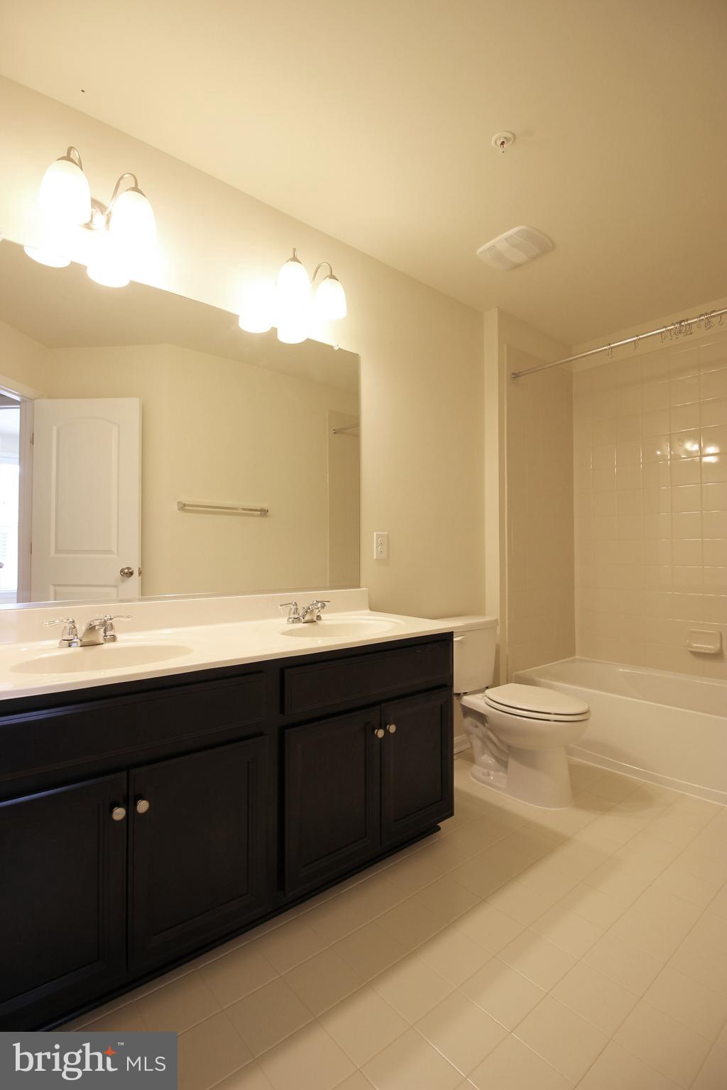 4720 Cambria Road Frederick, MD 21703 - Photo 25 of 41 a bathroom with a sink and a mirror