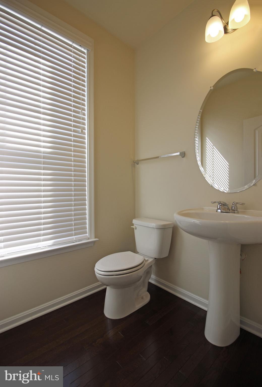 4720 Cambria Road Frederick, MD 21703 - Photo 6 of 41 a bathroom with a toilet sink and mirror