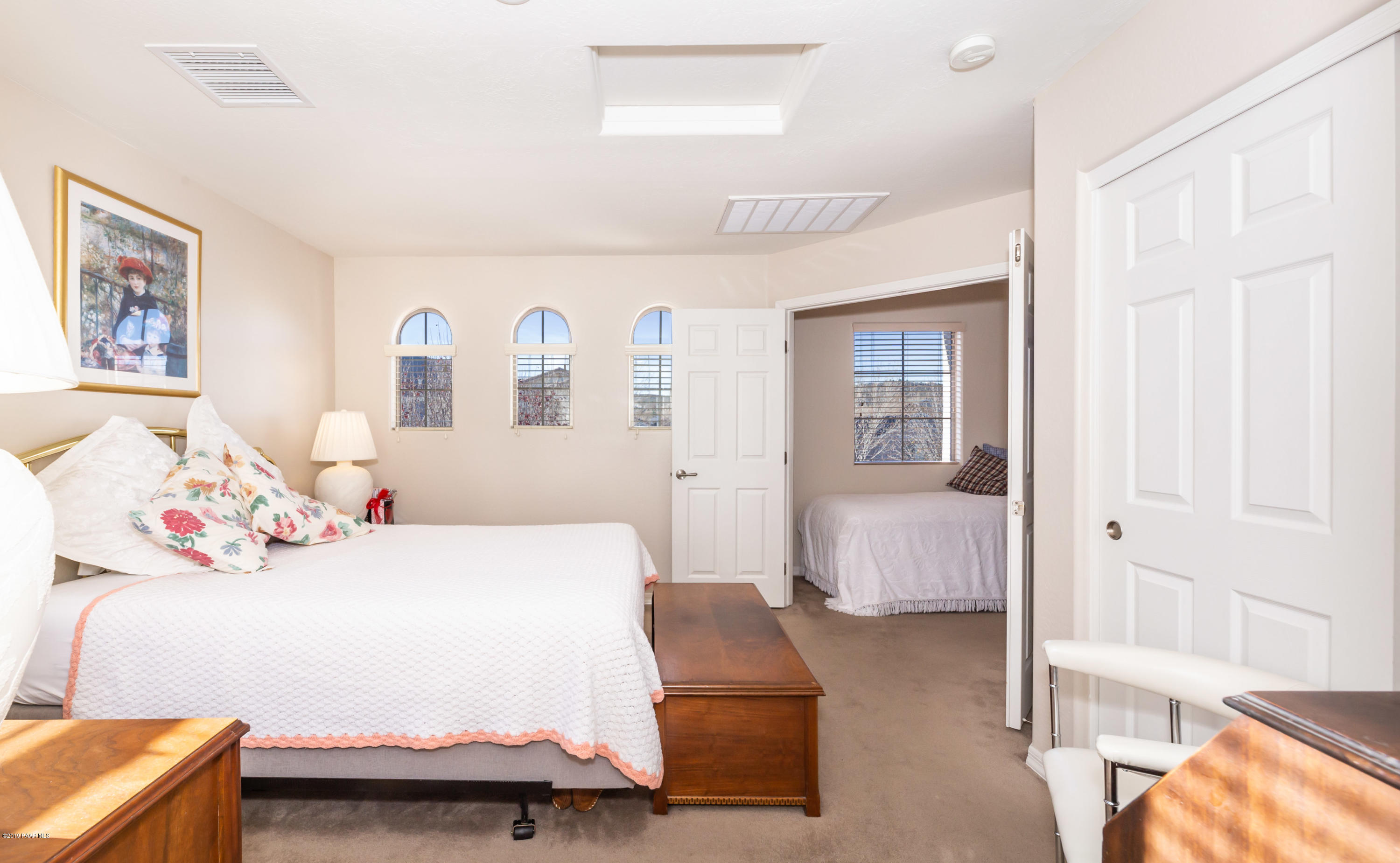 7258 Woolsey Ranch Road Prescott Valley, AZ 86314 - Photo 14 of 28 a bedroom with a bed and a couch
