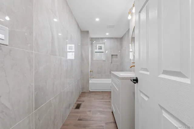 a spacious bathroom with a shower and a tub