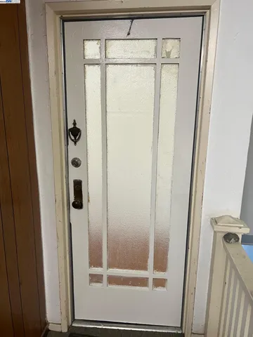 a bathroom with a glass shower door