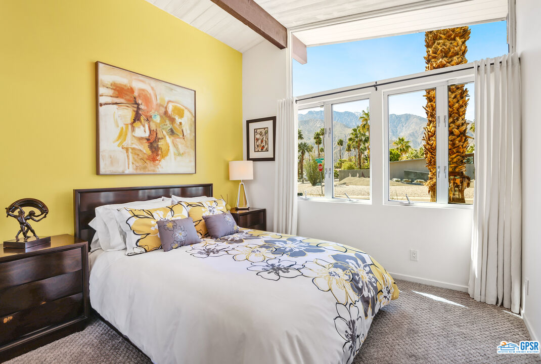 2108 George Drive Palm Springs, CA 92262 - Photo 12 of 33 a bedroom with a bed and a painting on the wall