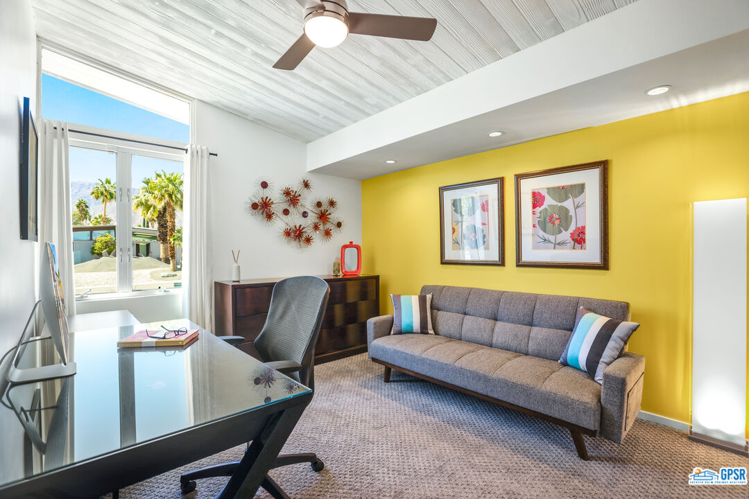 2108 George Drive Palm Springs, CA 92262 - Photo 13 of 33 a living room with furniture and a large window