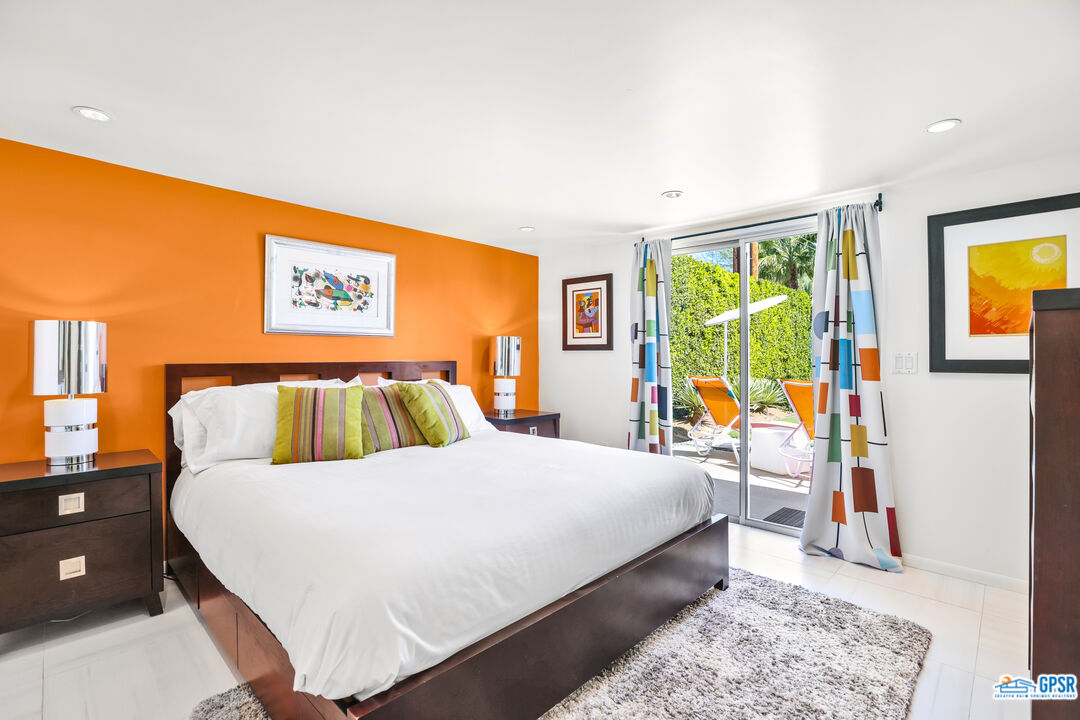 2108 George Drive Palm Springs, CA 92262 - Photo 15 of 33 a bed room with a bed and a painting on the wall