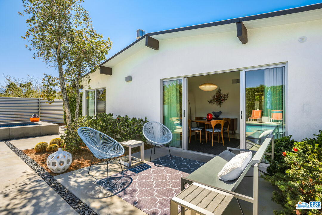 2108 George Drive Palm Springs, CA 92262 - Photo 19 of 33 a view of a patio with couple of chairs and potted plants