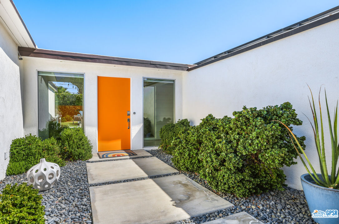 2108 George Drive Palm Springs, CA 92262 - Photo 3 of 33 a front view of a house with garden