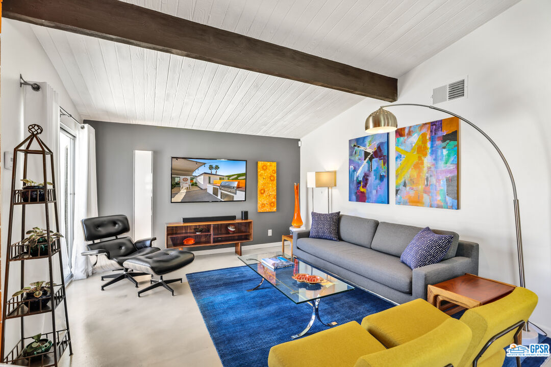 2108 George Drive Palm Springs, CA 92262 - Photo 8 of 33 a living room with furniture and a flat screen tv