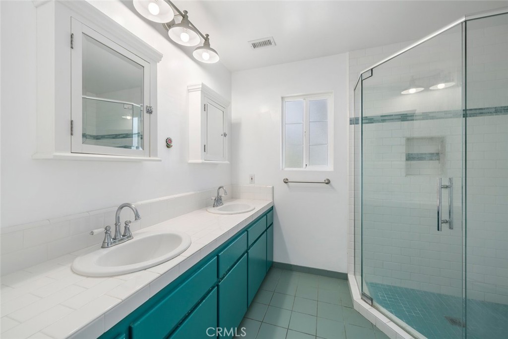 379 Harvey Street Cambria, CA 93428 - Photo 21 of 52 a bathroom with a sink a toilet and shower