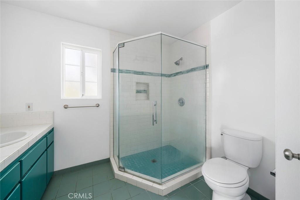 379 Harvey Street Cambria, CA 93428 - Photo 22 of 52 a bathroom with a shower a toilet and a sink