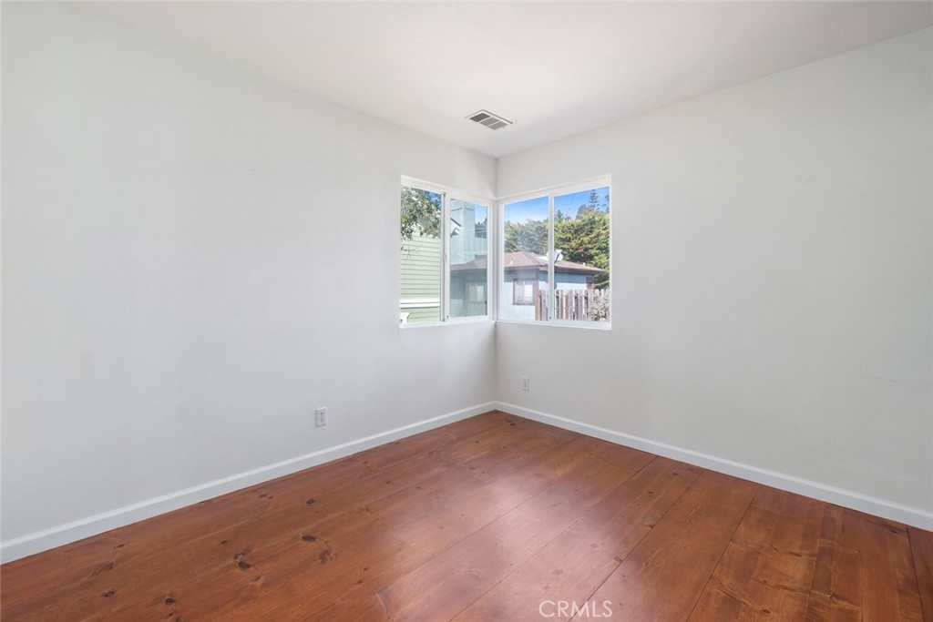 379 Harvey Street Cambria, CA 93428 - Photo 23 of 52 an empty room with windows