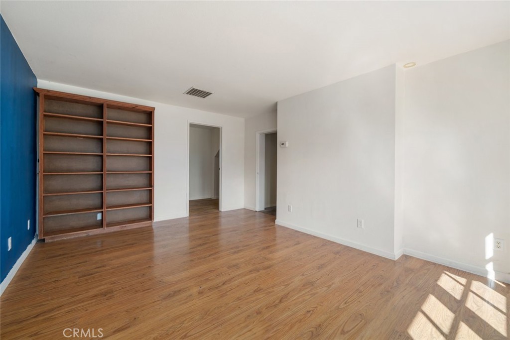 379 Harvey Street Cambria, CA 93428 - Photo 27 of 52 a view of an empty room with a wooden door