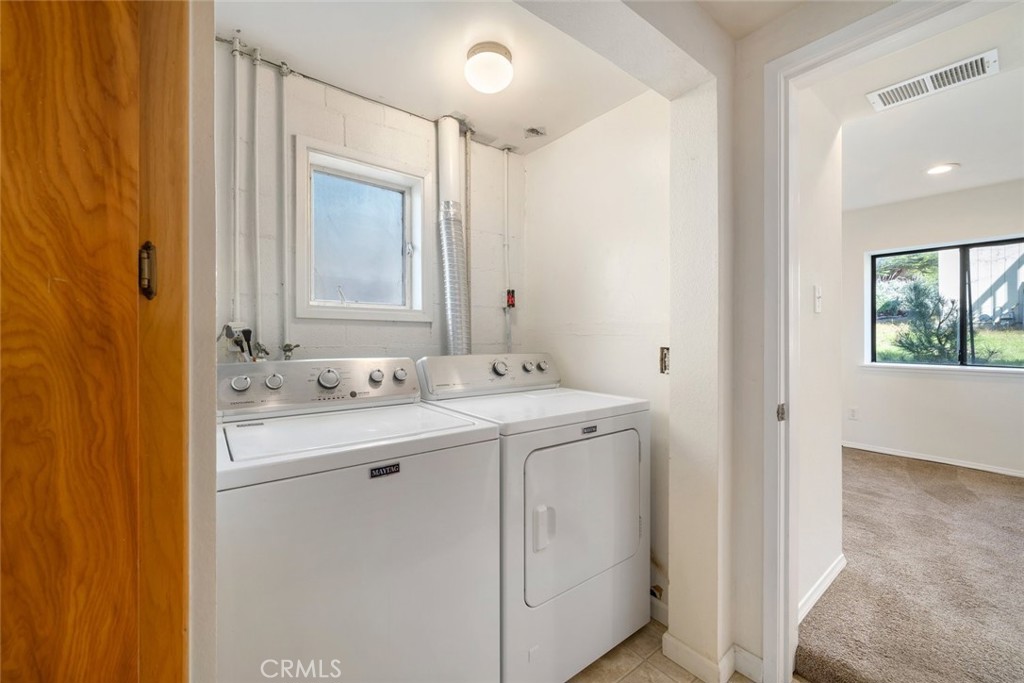 379 Harvey Street Cambria, CA 93428 - Photo 31 of 52 a bathroom with a granite countertop sink and a mirror
