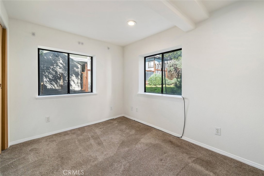 379 Harvey Street Cambria, CA 93428 - Photo 32 of 52 a view of an empty room with a window
