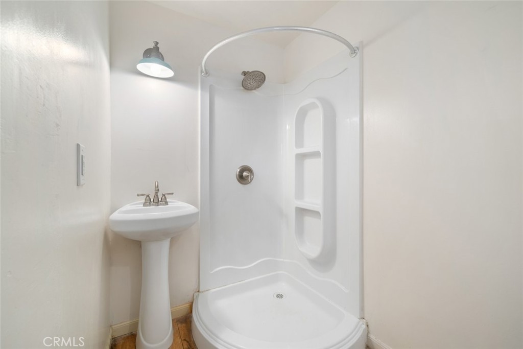 379 Harvey Street Cambria, CA 93428 - Photo 35 of 52 a bathroom with a sink a toilet and shower