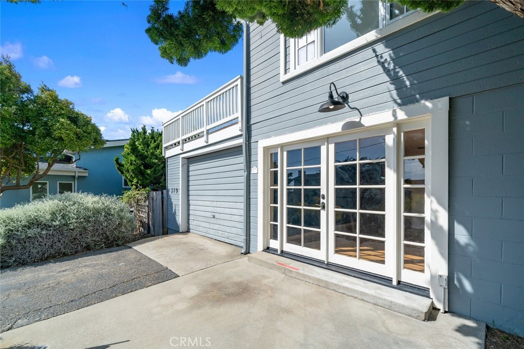 379 Harvey Street Cambria, CA 93428 - Photo 40 of 52 a view of a house with a yard and potted plants