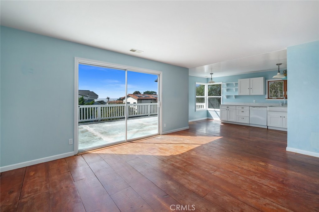 379 Harvey Street Cambria, CA 93428 - Photo 4 of 52 a view of kitchen with furniture and wooden floor