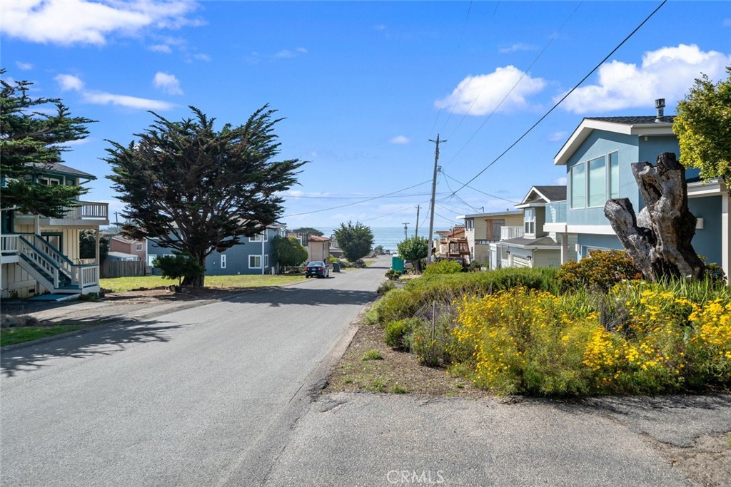 379 Harvey Street Cambria, CA 93428 - Photo 43 of 52 a view of a house with a yard and sitting area
