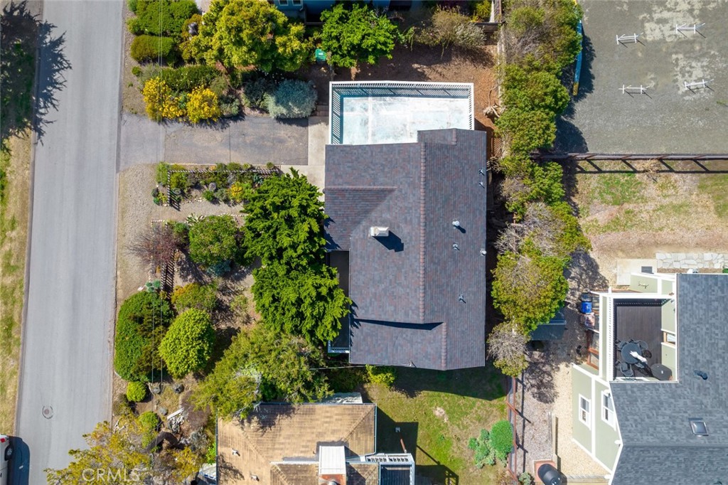 379 Harvey Street Cambria, CA 93428 - Photo 52 of 52 an aerial view of a house with a yard and garden