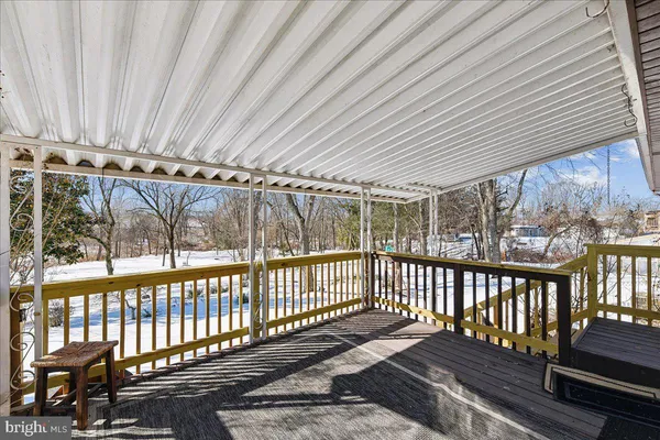 a porch with wooden floor