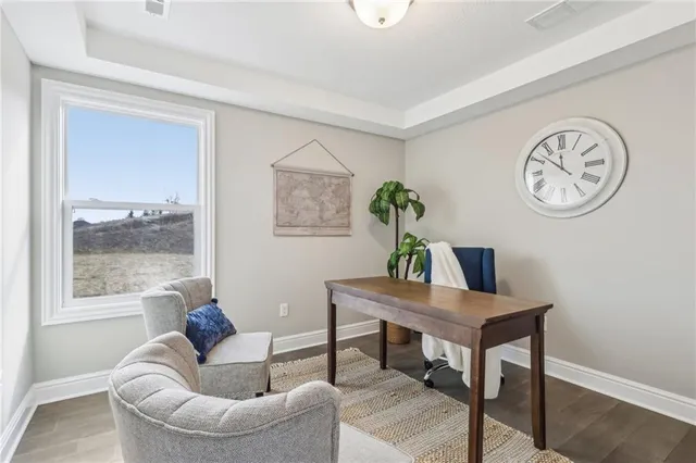 a living room with furniture a window and a table