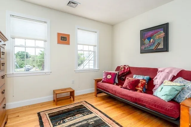 a living room with a couch and a window