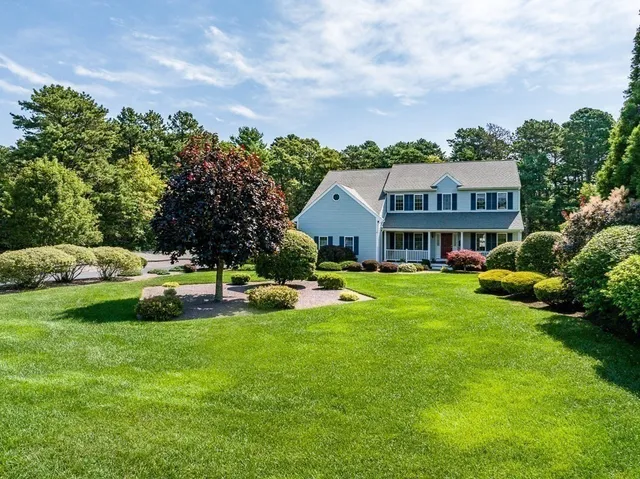 a aerial view of a house with swimming pool and garden