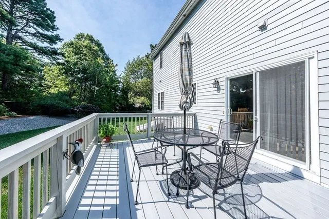a view of balcony with furniture and wooden deck