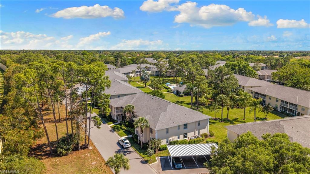 776 Landover Circle, Unit 104 Naples, FL 34104 - Photo 21 of 25 an aerial view of residential houses with outdoor space