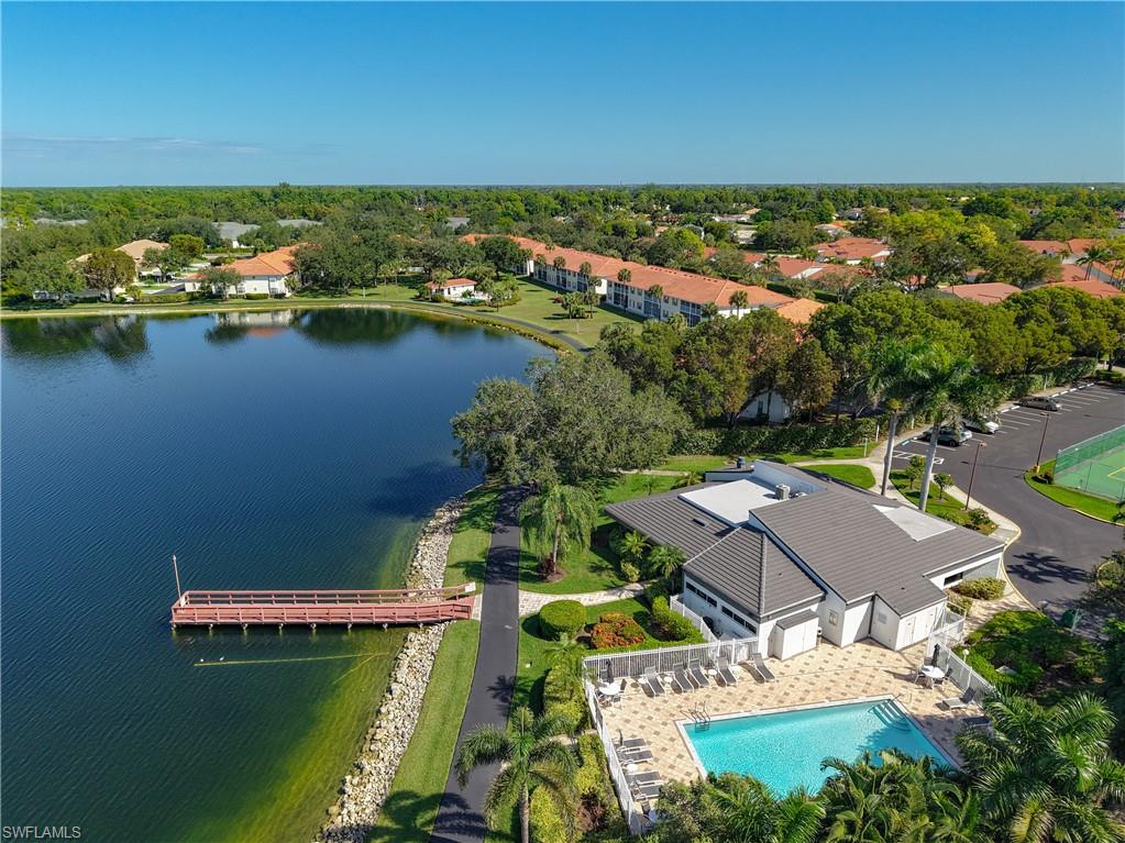 776 Landover Circle, Unit 104 Naples, FL 34104 - Photo 24 of 25 an aerial view of residential houses with outdoor space and river