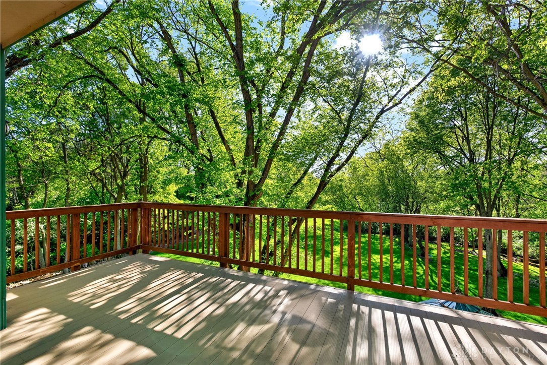 330 South Alpha Bellbrook Road Bellbrook, OH 45305 - Photo 37 of 87 Enjoy tranquil treetop views and sun-dappled moments on this spacious outdoor deck.