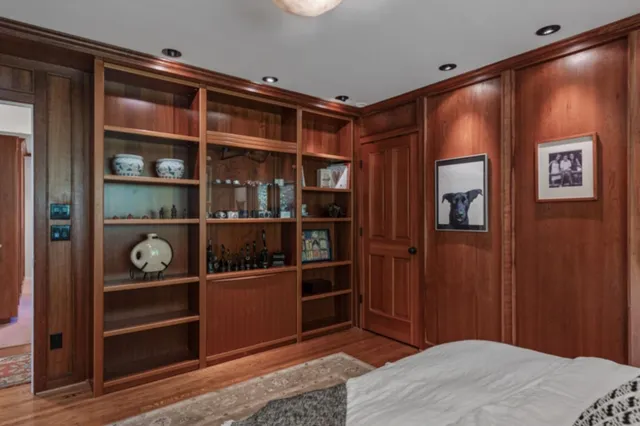 a bedroom with a bed and a closet